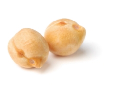 Two chickpeas on a white surface
